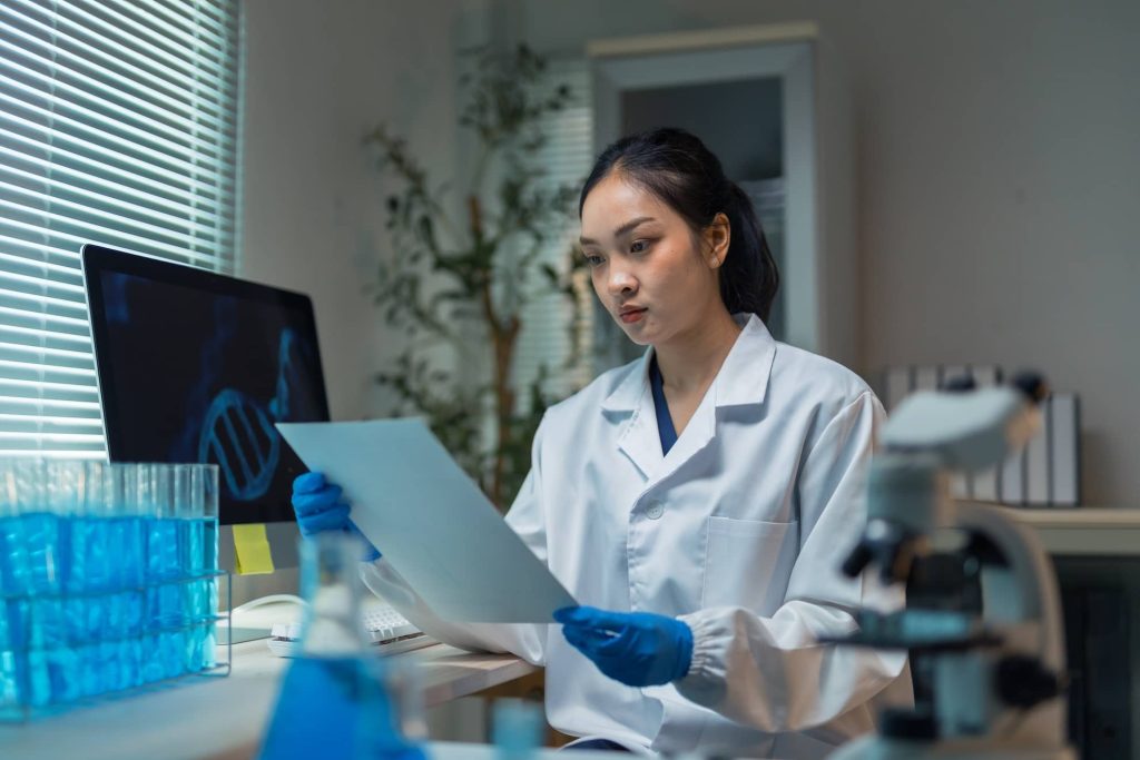 asian-female-scientist-analyzing-dna-research-resu-2026-01-11-10-34-47-utc